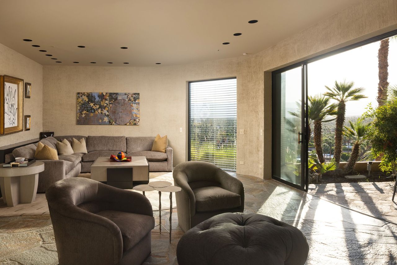 Guesthouse living room with sectional and sliding glass to terrace