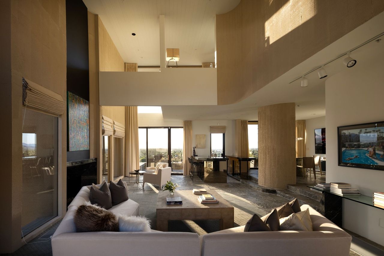 Double-height great room with mezzanine and curtained glass